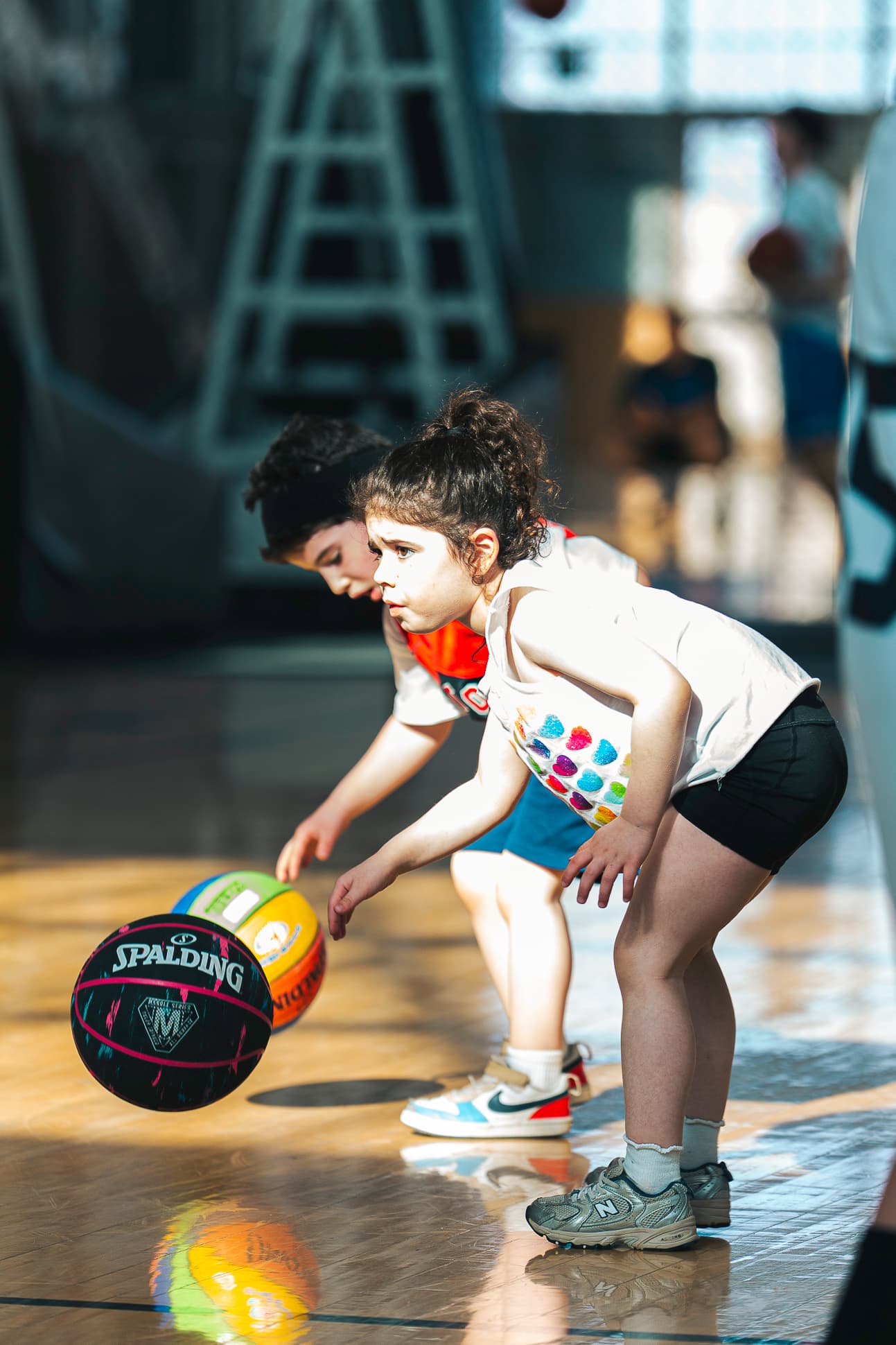 A young athlete locked in on her dribble during a Next Gen session